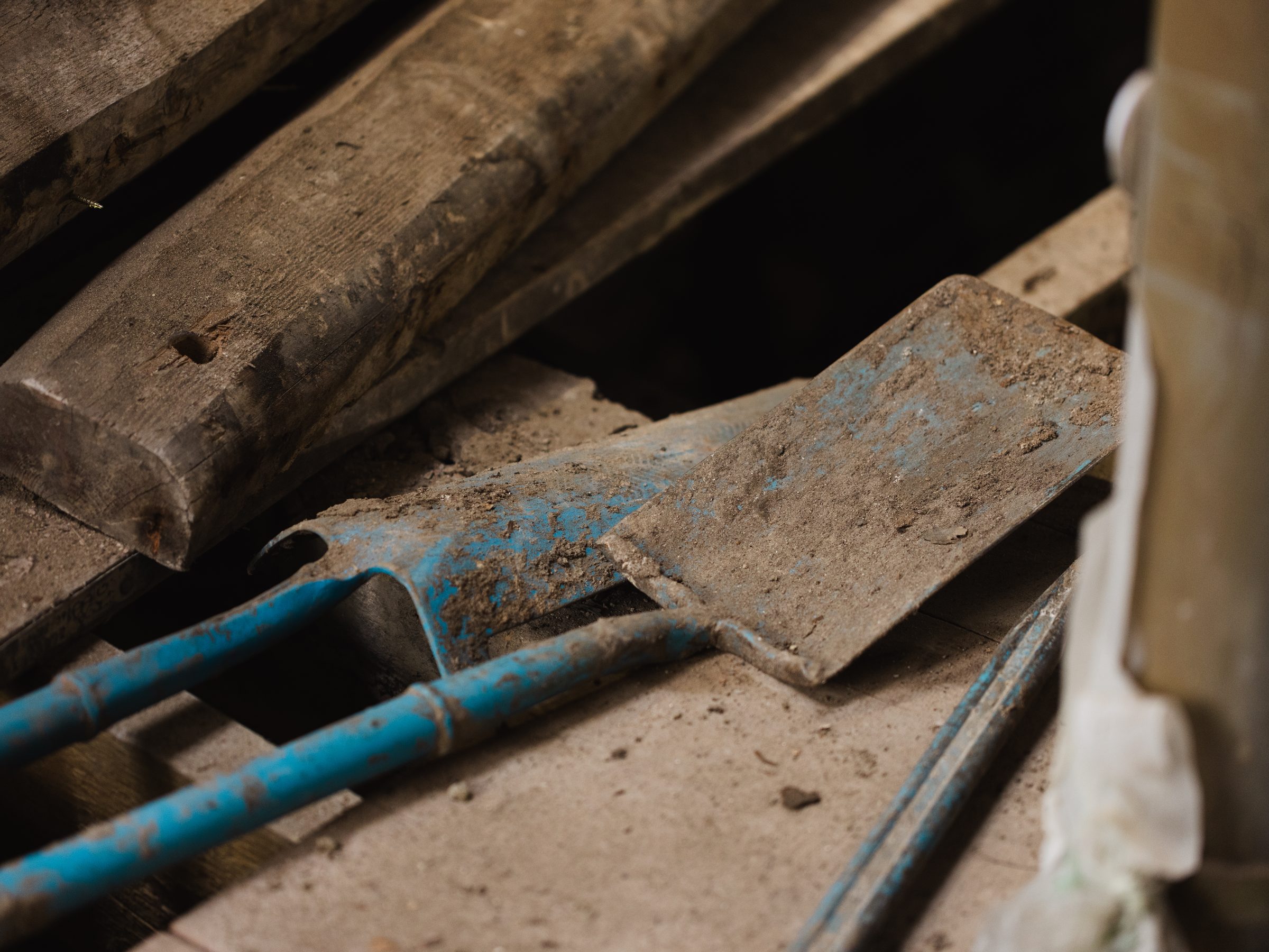 Timber, tools and blue pipework on site
